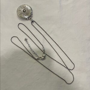 Brighton locket with 18 inch chain and room for 2 pictures. Very collectible.